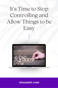 Image of a laptop screen showing an image of hand arranging lettered tiles into the word 'easy' while unused tiles are scattered on the wooden desk to the left hand side.